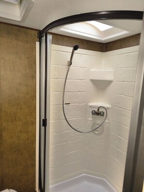 Shower, towels, soap, toilet paper