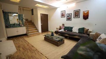 Luxury Apartment | Living area | Flat-screen TV