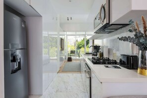 Microwave, stovetop, coffee/tea maker, toaster