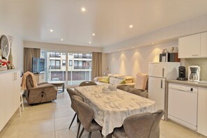 Enjoy a comfortable stay with a sofa, coffee machine, and refrigerator in this well-appointed living space.