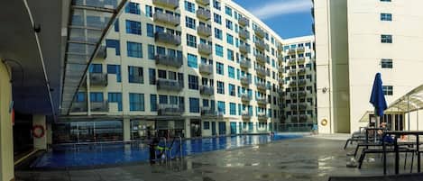 Outdoor pool, open 8:00 AM to 5:00 PM, pool umbrellas