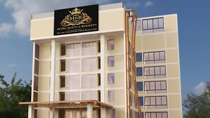 Un moderno edificio de hotel con un cartel que dice 'Hotel Sweta & Banquets'.