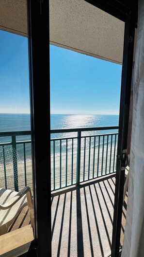 A balcony with a view of the ocean and beach. - Sand Castle Resort #14, Gorgeous Oceanview (Myrtle Beach)