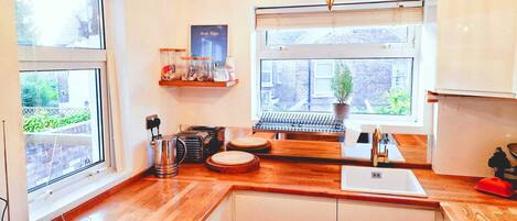 Fridge, dishwasher, toaster, cookware/dishes/utensils