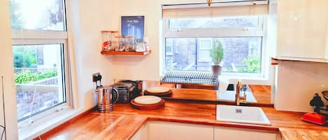 Fridge, dishwasher, toaster, cookware/dishes/utensils