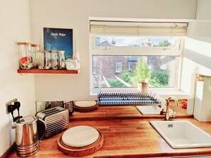 Fridge, dishwasher, toaster, cookware/dishes/utensils