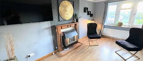 House | Living area | TV, fireplace