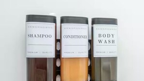 Three bottles of hair care products labeled shampoo, conditioner, and body wash. - Jennifer’s Penthouse Loft | State House City Views (Providence)
