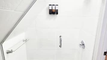 Shower, hair dryer, towels, shampoo