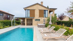 A modern two-story house with a swimming pool, outdoor seating, and a barbecue area. - Charming Villa Vallis with swimming pool, jacuzzi and sauna (Kadumi)