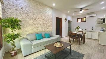 Deluxe Apartment, Garden View | Living area | 43-inch Smart TV with digital channels, Netflix, streaming services