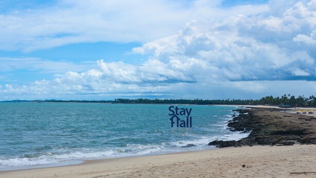 A beach with a sign that reads "Stay Hall" indicating a short-term rental property. - House with private pool-4qrts Serrambi-086 (Ipojuca)
