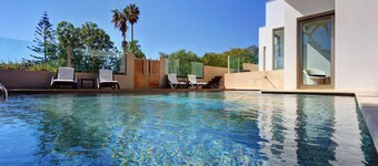 Modern beachfront villa with heated pool and jacuzzi, ideal for families