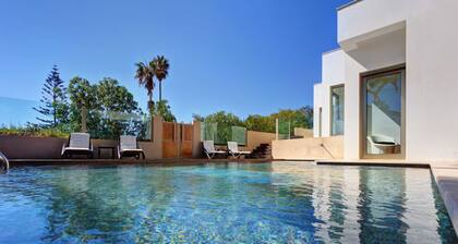 Modern beachfront villa with heated pool and jacuzzi, ideal for families