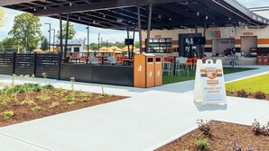 A food court named 'Fifty West' with outdoor seating and a covered area.