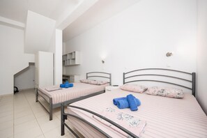 A bedroom with two beds, a desk, and a staircase. - Villa Sapfo - Two Bedroom Villa, Sleeps 4 (Lefkada)
