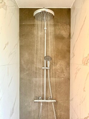 Shower, hair dryer, towels, soap