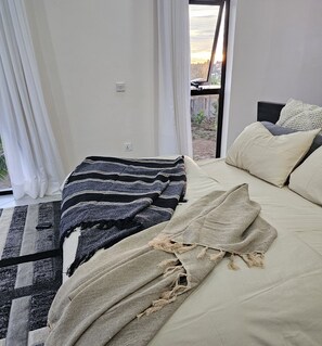 Desk, laptop workspace, blackout curtains, iron/ironing board - Muguet by Ibiscot Development (Entebbe)