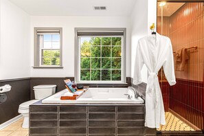 Shower, jetted tub, towels