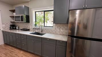 Fridge, microwave, stovetop, coffee/tea maker
