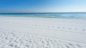 A beach with white sand and clear blue water. - Emerald Escape! Newly remodeled spacious 3-bedroom condo with oversized balcony! (Destin)
