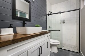 Shower, hair dryer, towels, soap