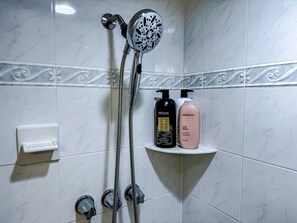 Shower, hair dryer, towels, soap