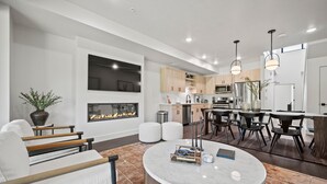 A modern kitchen with wooden cabinets, a built-in microwave, and a stainless steel refrigerator. - Alpine Adventure Pt C201 | Ski Escape | Powder Mtn (Eden)