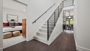 A staircase with a metal railing leading to a second floor. - Alpine Adventure Pt C201 | Ski Escape | Powder Mtn (Eden)