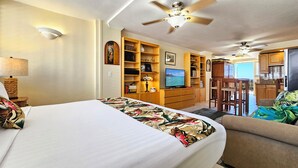 A hotel room with a bed, a desk, a television, and a kitchenette. - ⛩Best location in Waikiki Open design penthouse Studio-Waikiki Grand Hotel® 1005 (Honolulu)