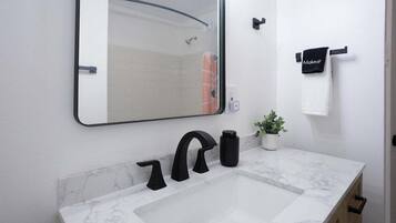 Hair dryer, towels, soap, shampoo