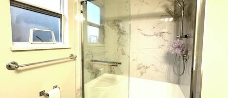 Shower, hair dryer, towels, soap