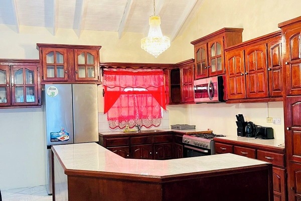 Villa, Courtyard View | Private kitchen | Full-size fridge, microwave, electric kettle, dining tables
