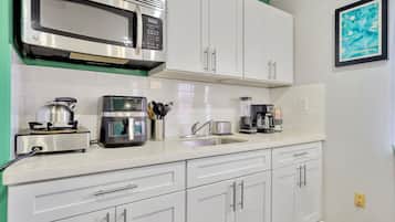 Fridge, microwave, stovetop, coffee/tea maker