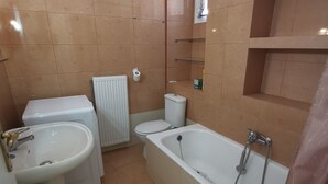 A bathroom with a sink, toilet, and bathtub. - RENT HOUSE ROOMS KALAMATA  (Agios Dionisios)