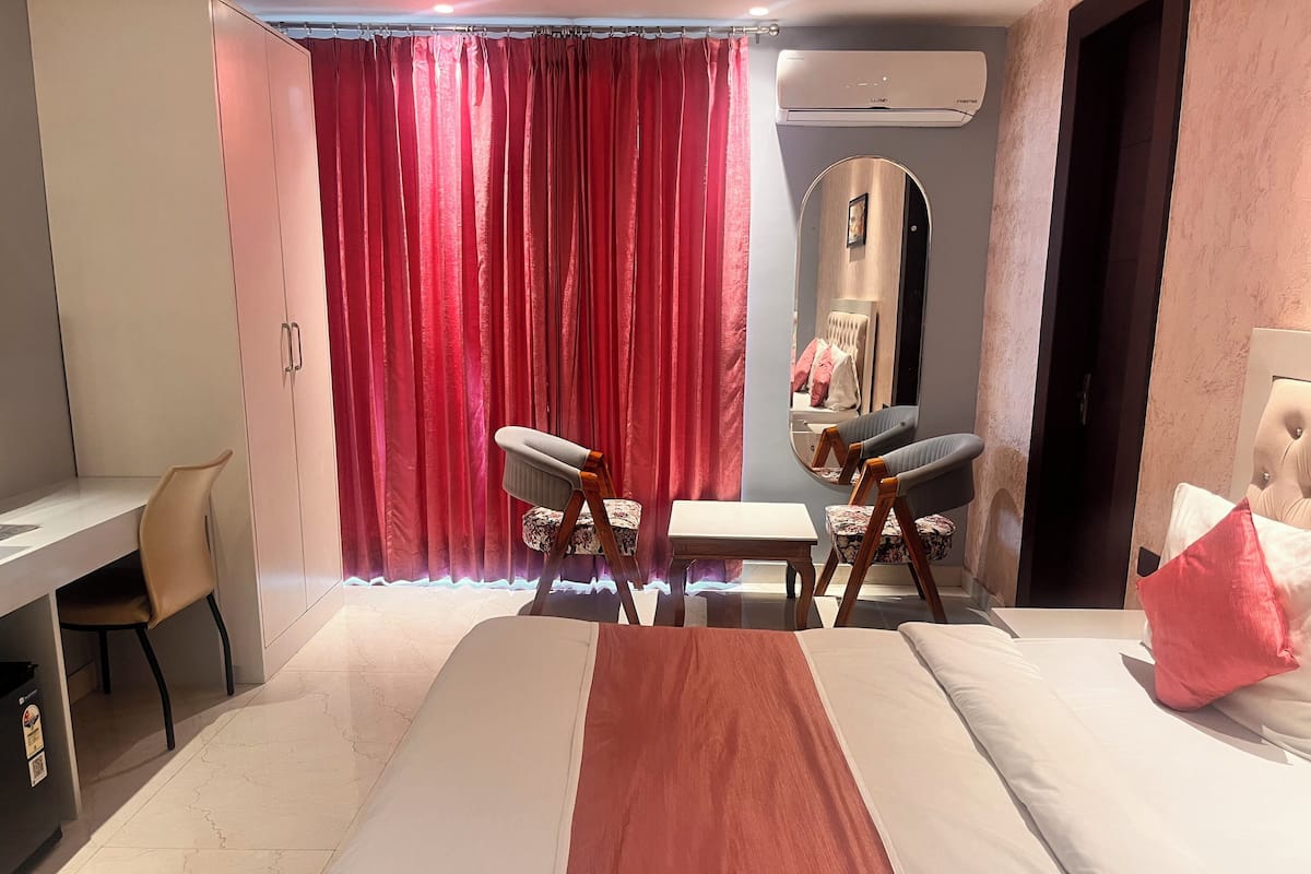 Premium bedding, desk, laptop workspace, soundproofing