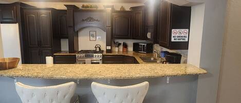 Fridge, microwave, oven, cookware/dishes/utensils