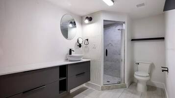 Shower, hair dryer, towels, soap