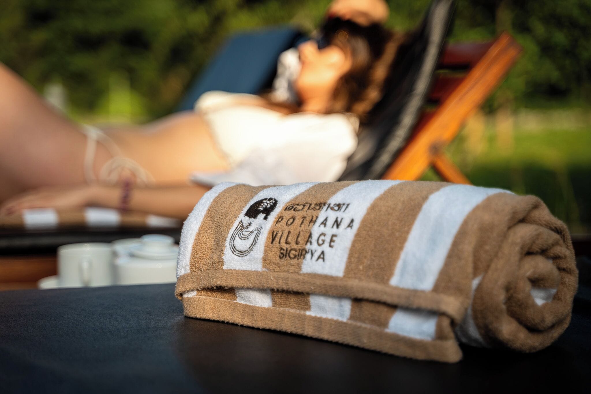 A towel with a logo and text indicating a location.