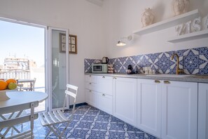 Microwave, stovetop, electric kettle, coffee grinder