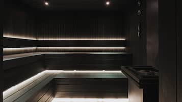 A dimly lit sauna with wooden benches and a tiled floor.