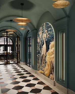 Stunning corridor with a checkered floor, glass door entrance, and a beautiful mural adorns the wall.