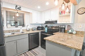 Fridge, microwave, oven, stovetop - Sunbird Resort - 5th Floor - 3 Pools, Oceanfront - by Sunbird Rentals (Panama City Beach)