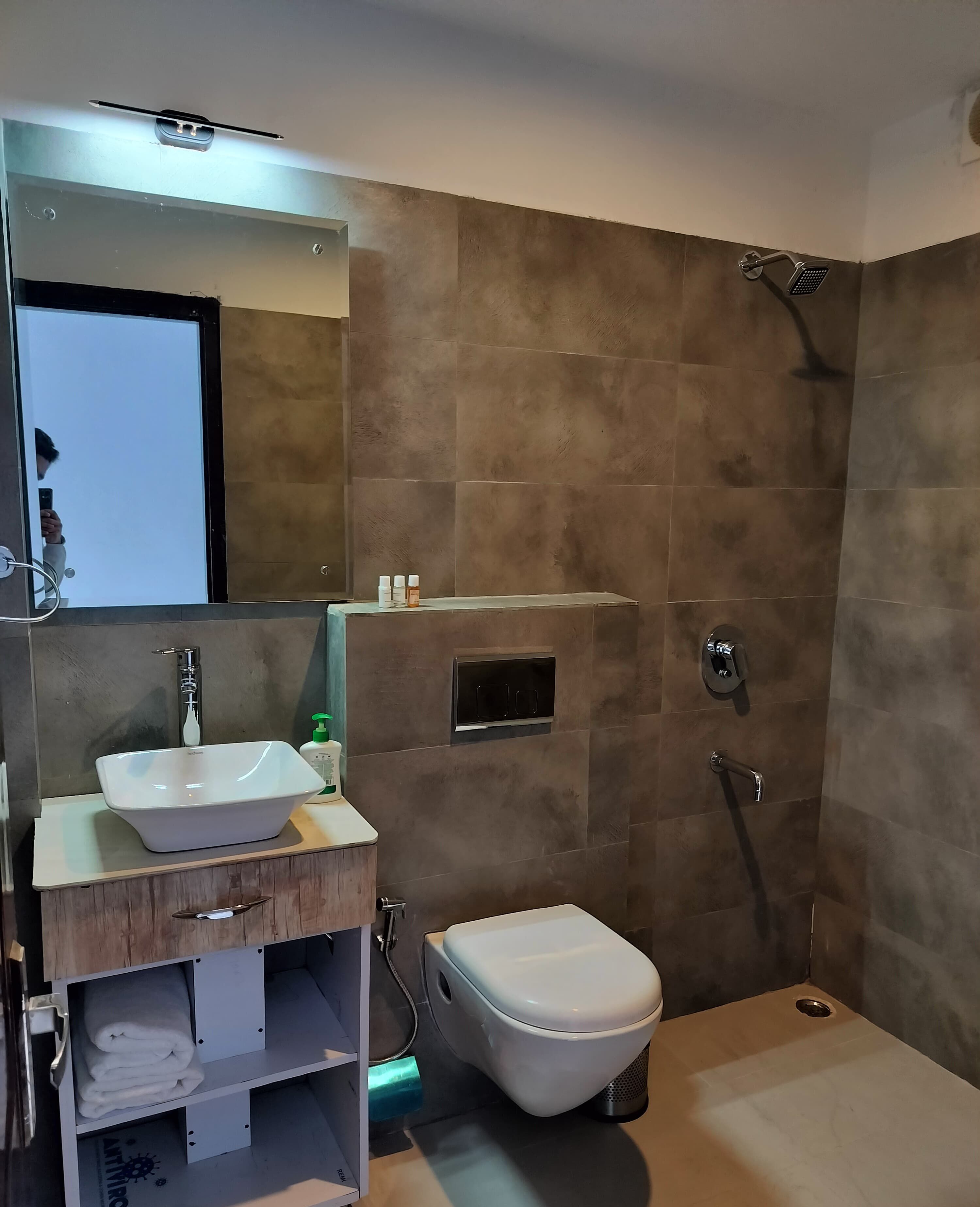 Shower, slippers, towels, soap