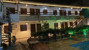 A two-story building with a pool, outdoor seating, and a staircase. - Pousada Boa Esperança Beach (Ipojuca)