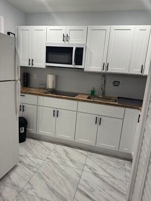 Microwave, stovetop, coffee/tea maker, toaster