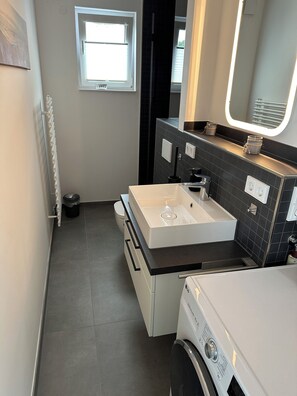 Shower, eco-friendly toiletries, hair dryer, towels