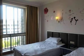 A hotel room with a large window, a bed with white bedding, a headboard, and decorative wall art including roses and a lamp. - Xianju Tianyuan Hotel (Xianju)