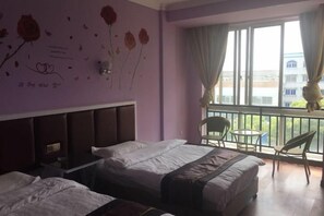 A hotel room with two beds, a balcony with chairs, and a view of a building. - Xianju Tianyuan Hotel (Xianju)
