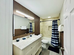 Shower, hair dryer, towels, soap